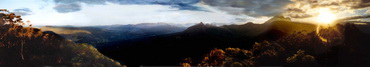 Icon photo of Mount Warning at sunset, with the 3 sisters to the left and Border Ranges in the distance